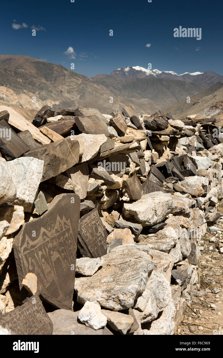 India, Himachal Pradesh, Yangthang, mani wall stones inscribed with Tibetan Script mantras Stock Photo