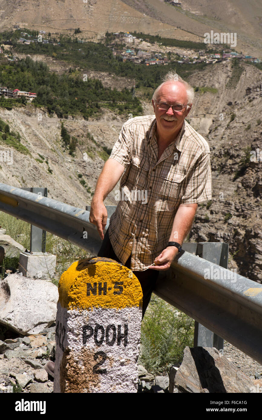 India, Himachal Pradesh, Kinnaur, Pooh, toilet humour, senior male tourist at amusing place name sign Stock Photo