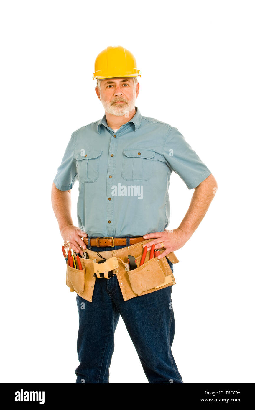 Middle-aged Repairman With Tool Belt and Hard Hat Stock Photo
