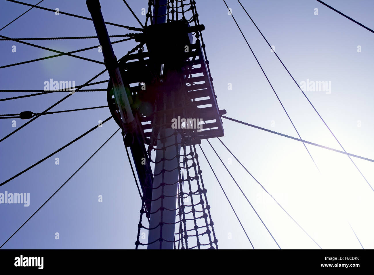 Mast silhouette of sailing ship against sky and sun Stock Photo - Alamy