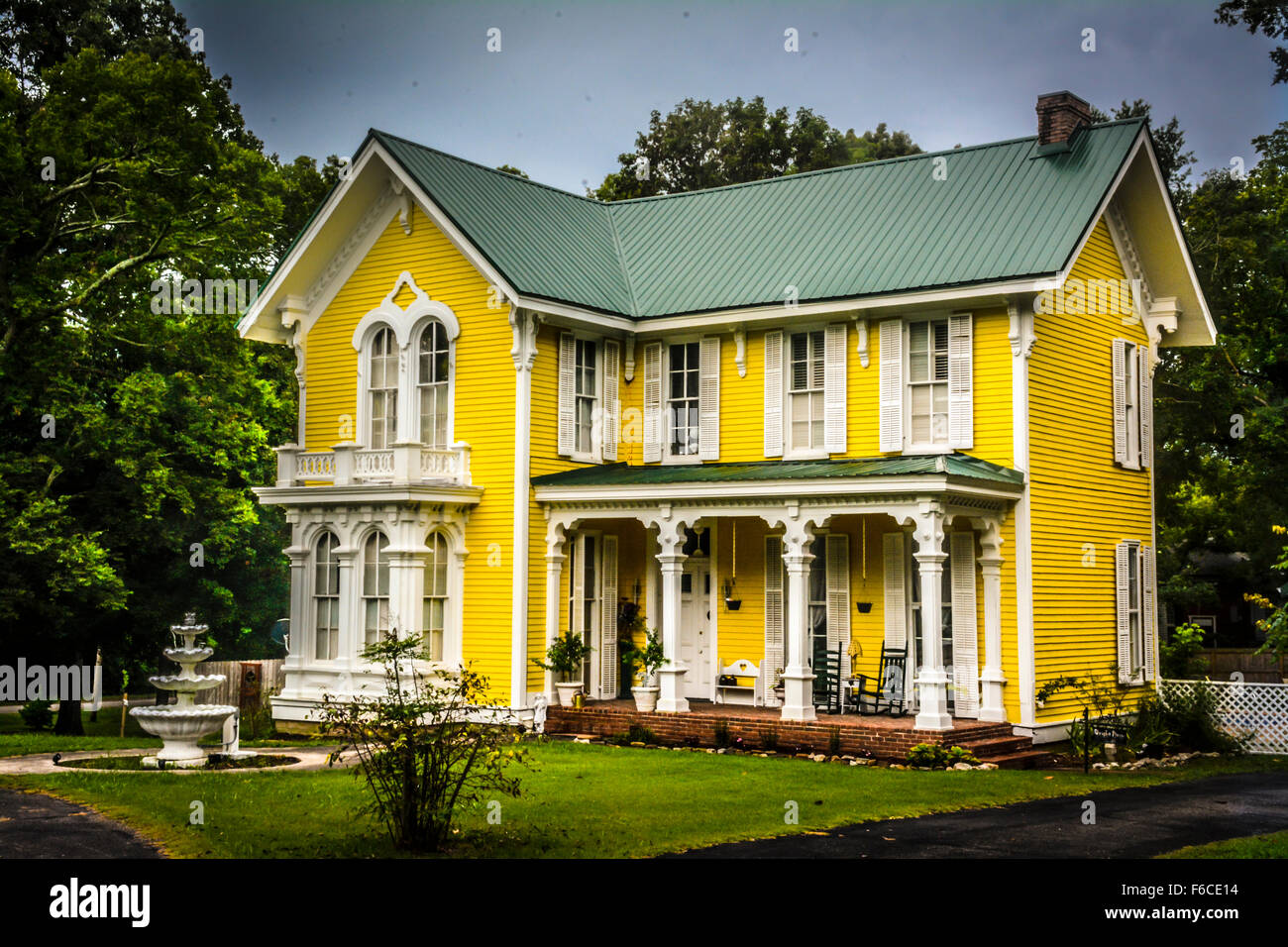 The Wright House, a fanciful two storied Yellow Victorian house built in 1867 accented with gingerbread style in Bolivar, TN Stock Photo