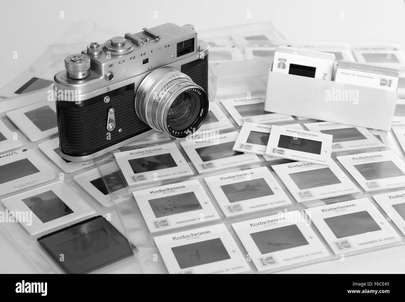 Old Russian 35mm Zorki film camera of a stack of old Kodachrome slides or transparencies filed in sleeves Stock Photo