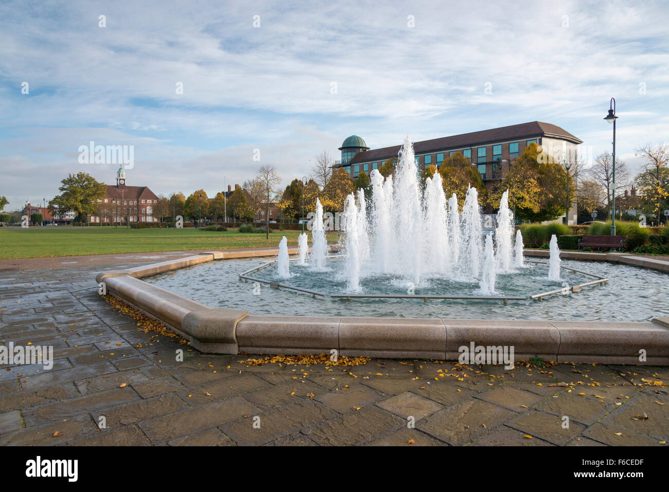 A fountain and view across a park and garden in Letchworth Garden City Hertfordshire UK Stock Photo