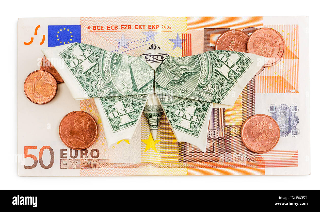 Dollar origami butterfly sits on 50 euro banknote with coins isolated on white background. Concept of two leading hard currencie Stock Photo