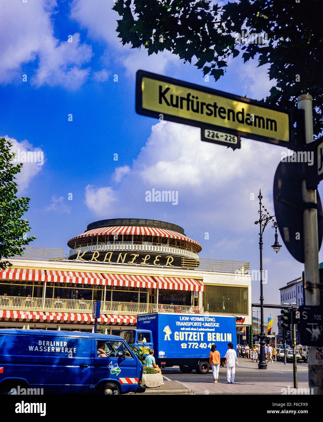 August 1986, Blue lorries in front of Cafe Kranzler and street sign on Kurfürstendamm avenue, Berlin, Germany, Europe Stock Photo