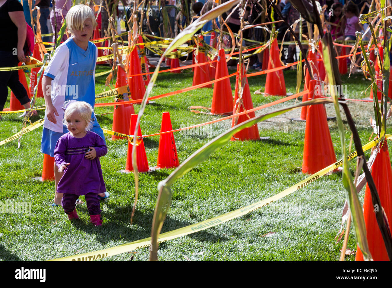 Arvada, Colorado - Children run through a 'cone maze' at the Festival of Scarecrows, a fall festival in Olde Town Arvada. Stock Photo