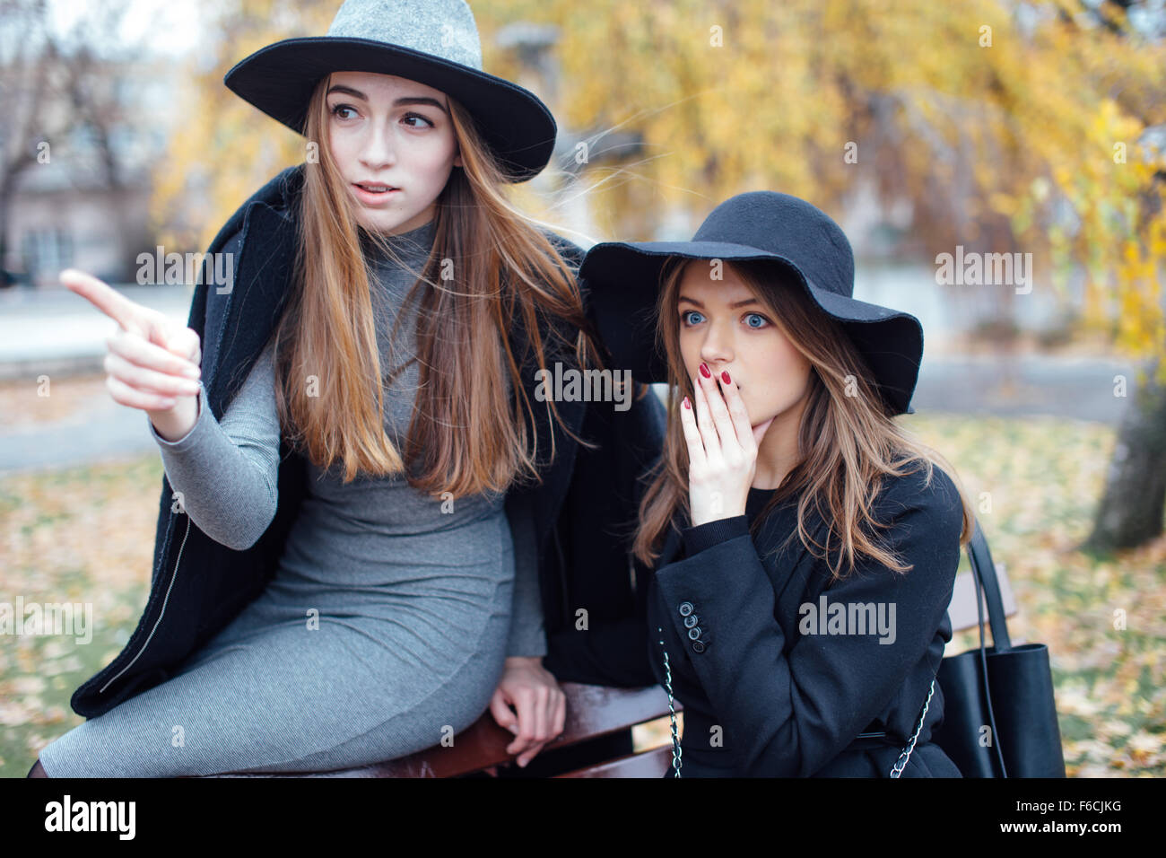 Two young girls walking on the street and posing to camera Stock Photo ...