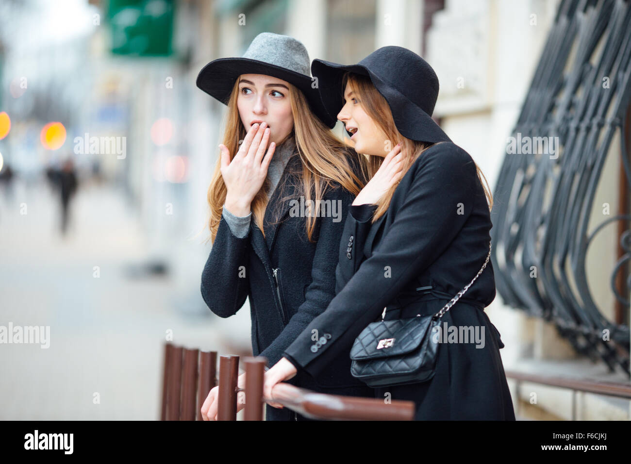 Two young girls walking on the street and posing to camera Stock Photo ...