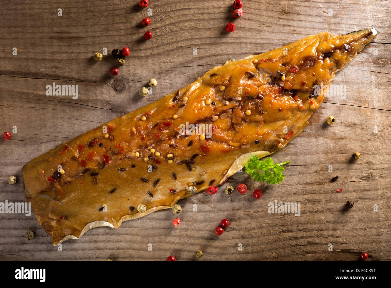 Smoked mackerel with peppercorns and mustard seeds Stock Photo