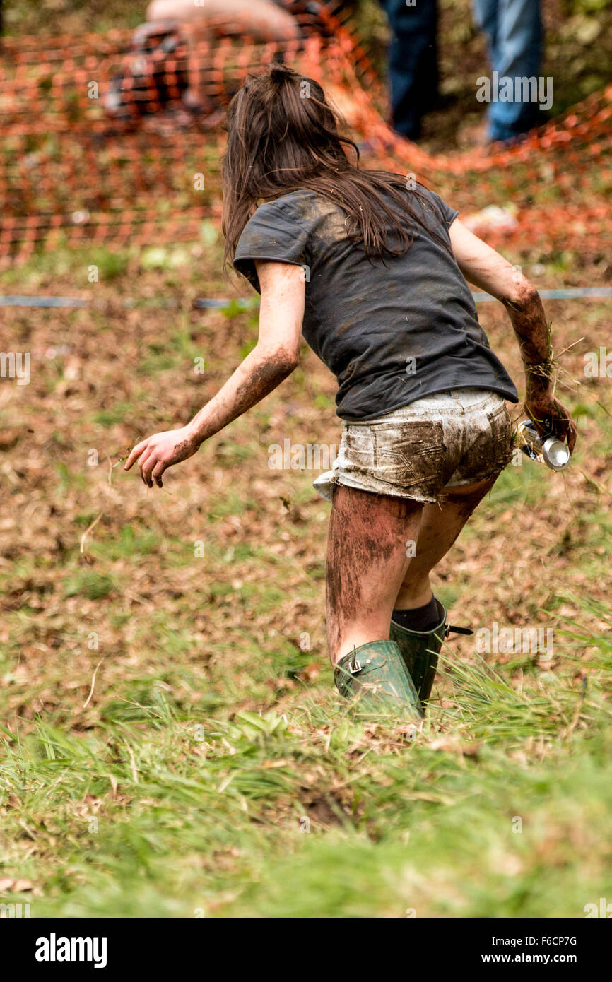 Muddy young woman walks away Stock Photo - Alamy