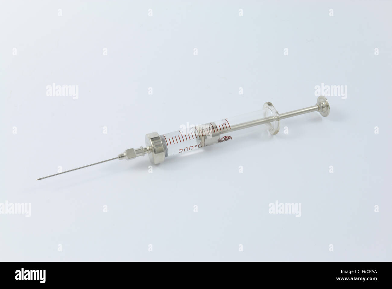 Vintage glass and metal syringe Stock Photo