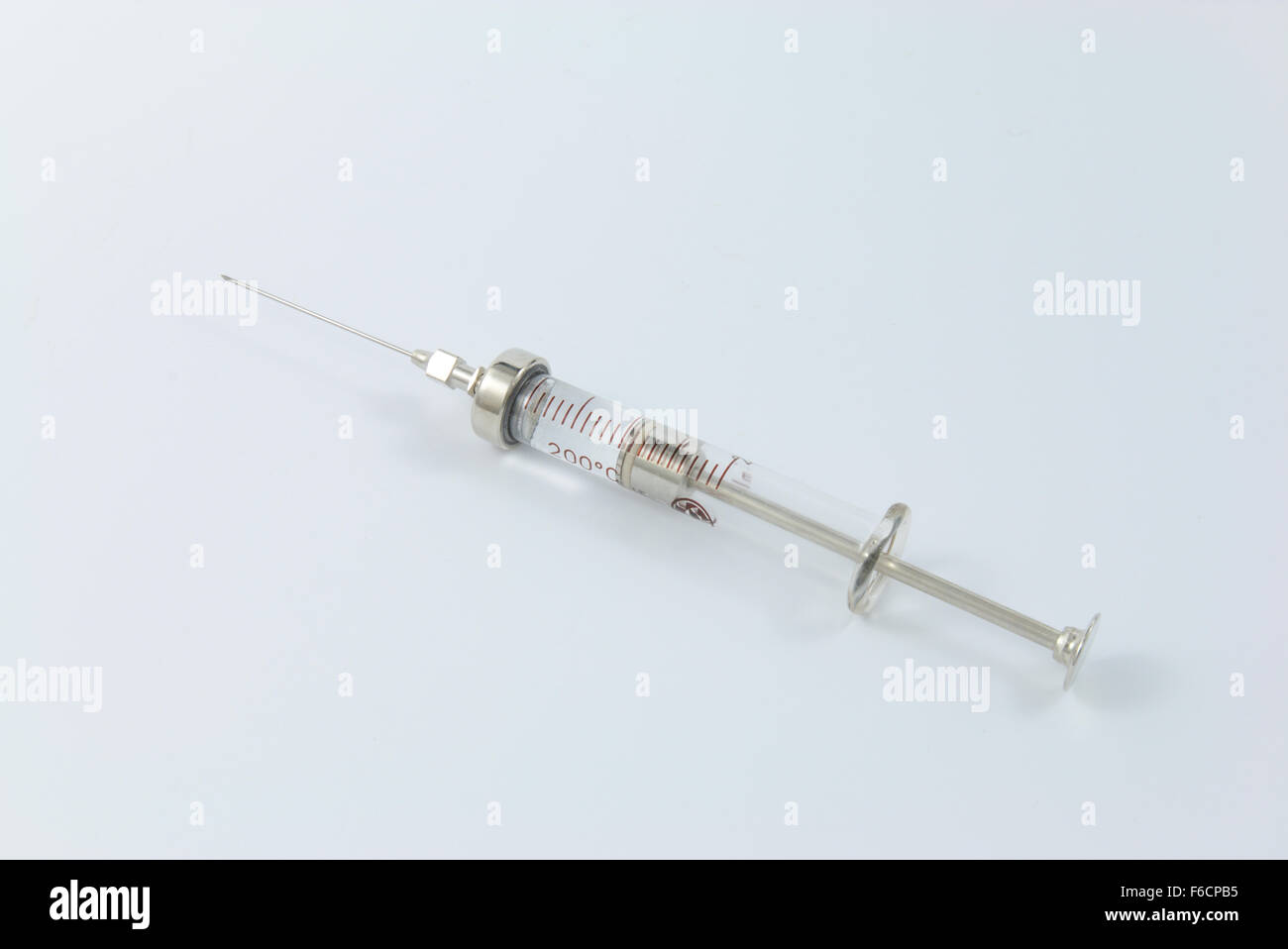 An old type syringe with needle Stock Photo