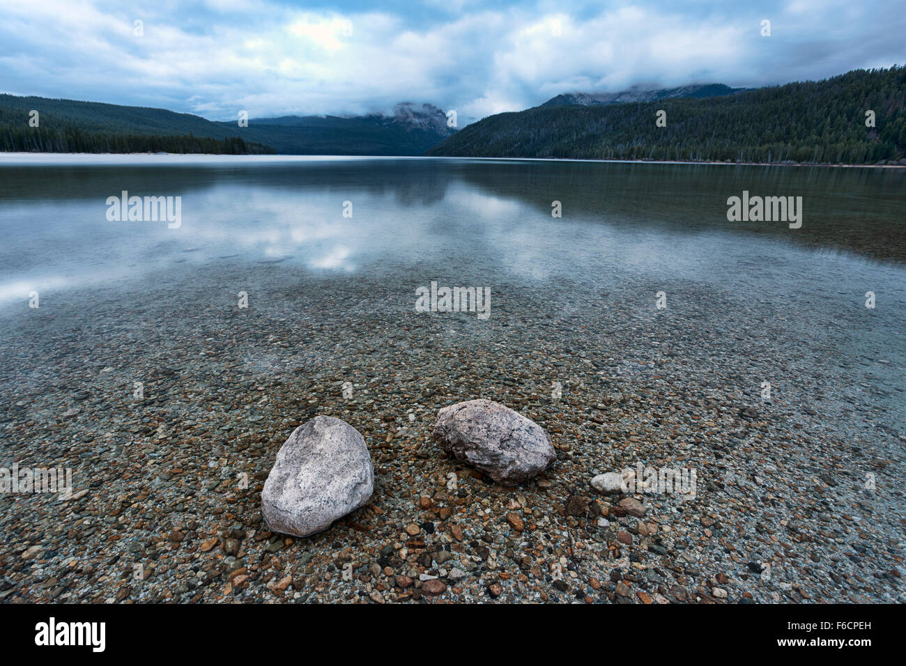 Two rocks in the shallow lake Stock Photo - Alamy