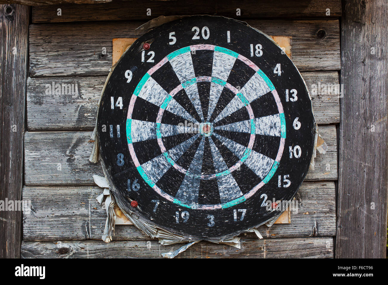 Old wooden target on wall. Stock Photo