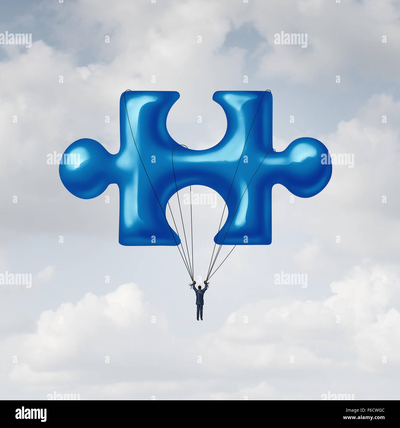 Leadership jigsaw puzzle concept as a solution metaphor with a businessman floating up to the sky with a balloon shaped as a fundamental key link unit to complete a project. Stock Photo