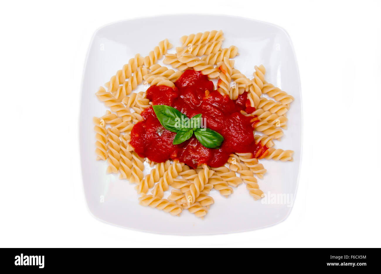Fusilli with tomato sauce on a white background seen from above Stock Photo