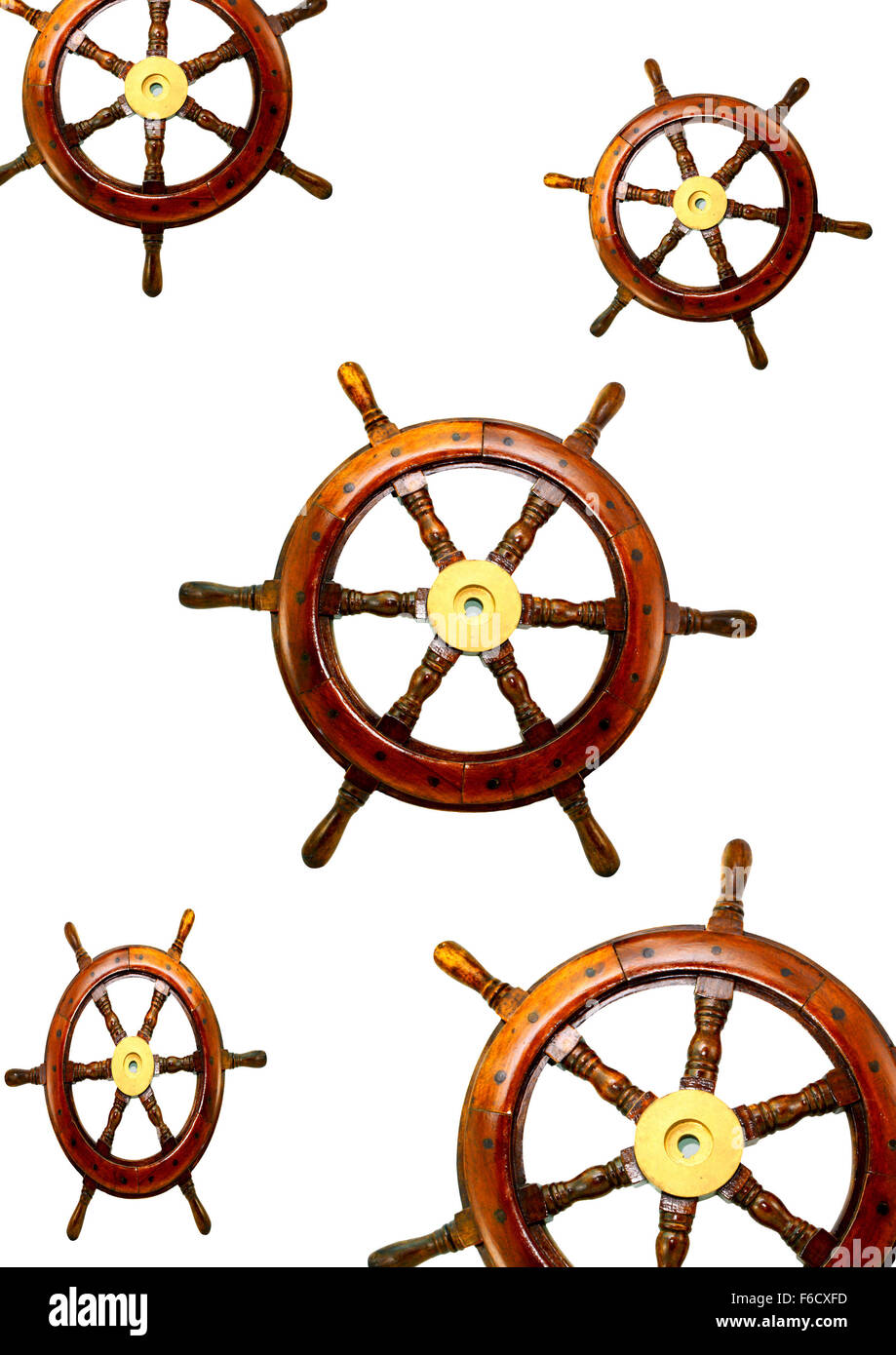 lots of wooden boat wheel on white background Stock Photo Alamy