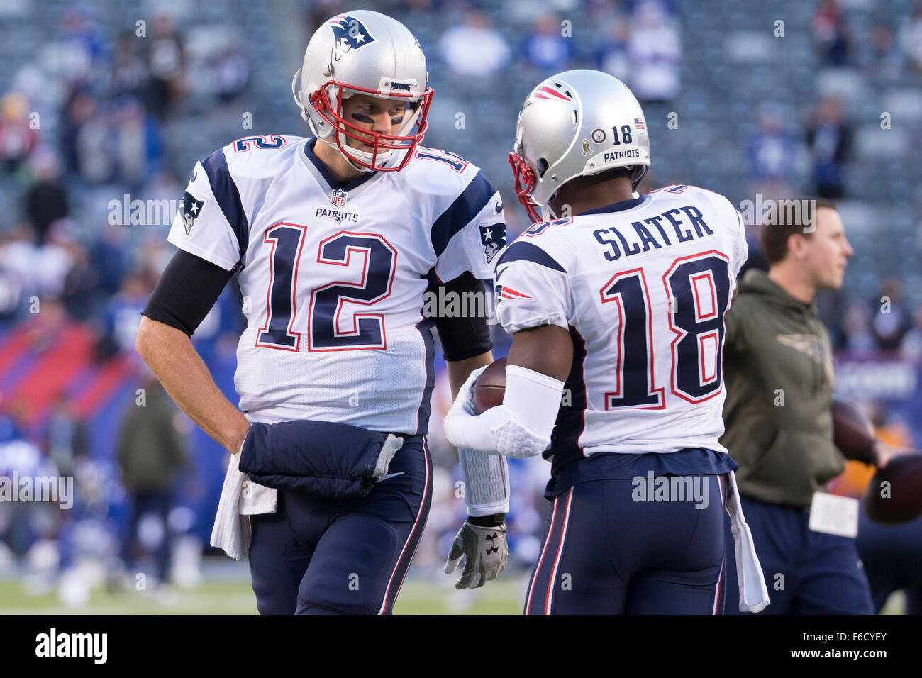 East Rutherford, New Jersey, USA. 15th Nov, 2015. New England Patriots quarterback Tom Brady (12) talks with wide receiver Matthew Slater (18) during warm-ups prior to the NFL game between the New England Patriots and the New York Giants at MetLife Stadium in East Rutherford, New Jersey. The New England Patriots won 27-26. Christopher Szagola/CSM/Alamy Live News Stock Photo