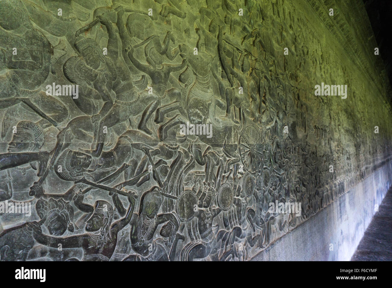 Angkor Cambodia: A long gallery of bas relief sculpture depicting Kurukshetra Battle at Angkor Wat Temple. Stock Photo