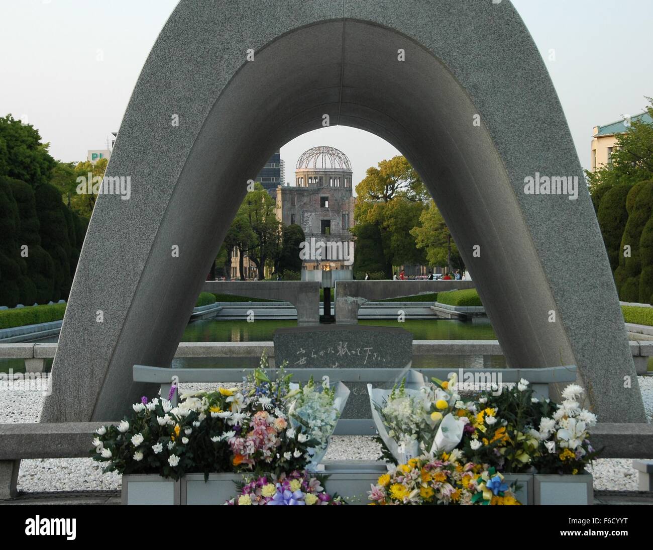 A view of the A-bomb dome through the memorial cenotaph at Hiroshima Peace Memorial Park, Hiroshima, Japan Stock Photo