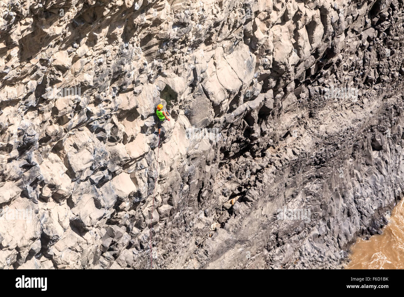 Basalt Challenge Of Tungurahua, Man Climbing Natural Rock Wall Stock Photo