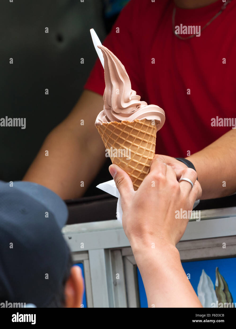 Selling ice cream with typical ice cream truck, detail of the hand of