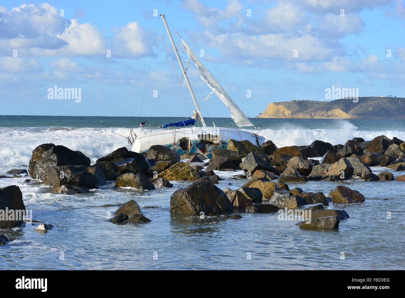 A Yacht being ship wrecked on the rocks on the beach at San Diego ...
