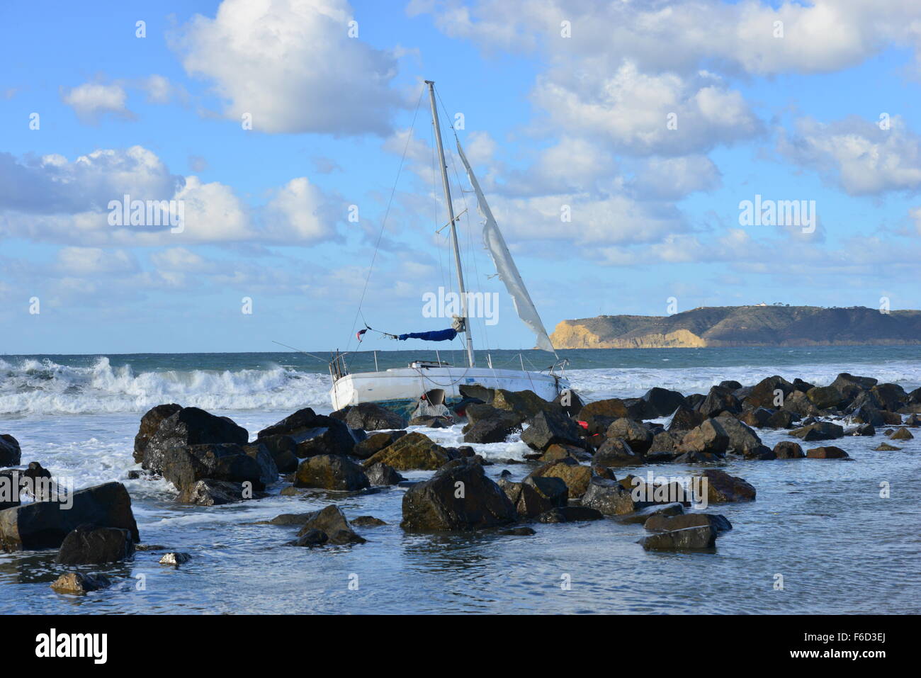 A Yacht being ship wrecked on the rocks on the beach at San Diego ...