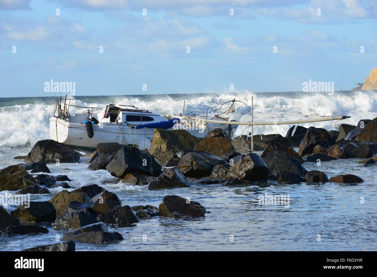 A Yacht being ship wrecked on the rocks on the beach at San Diego ...