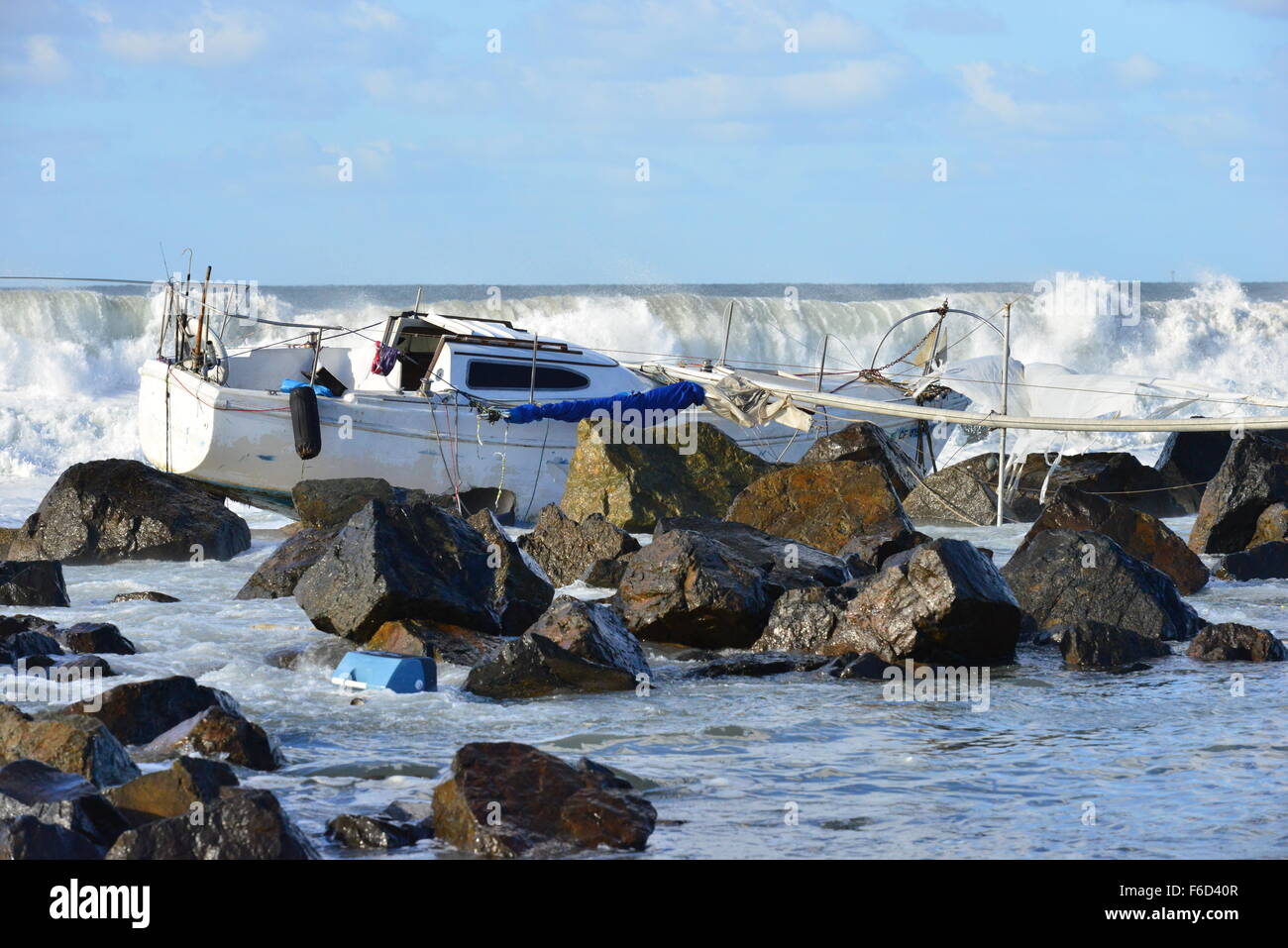 A Yacht being ship wrecked on the rocks on the beach at San Diego ...