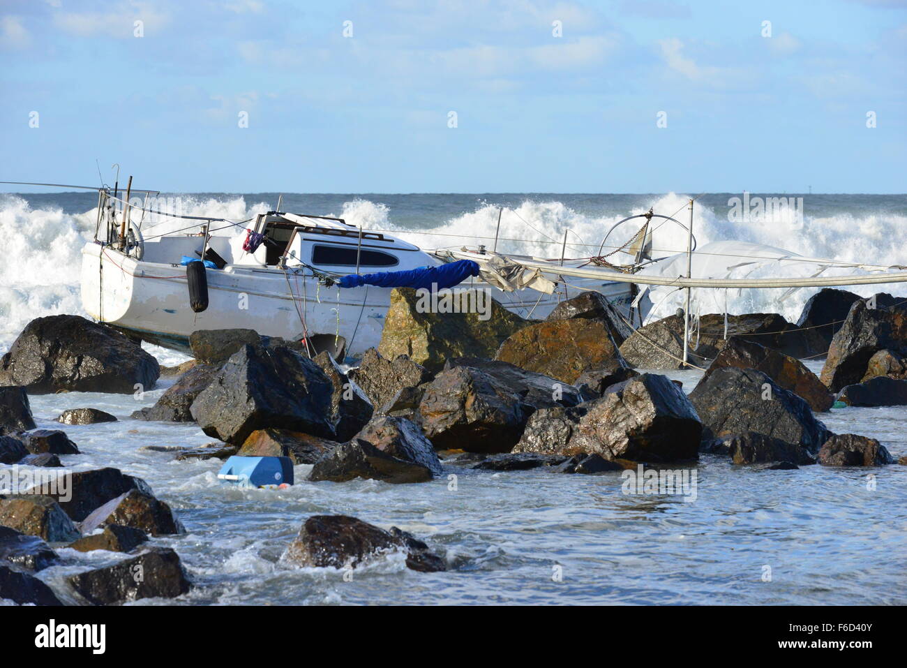 A Yacht being ship wrecked on the rocks on the beach at San Diego ...