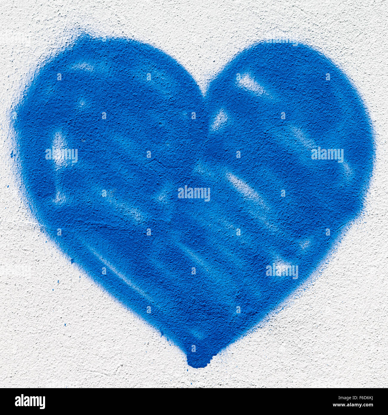 A big blue heart, painted on the wall with spray paint Stock Photo Alamy