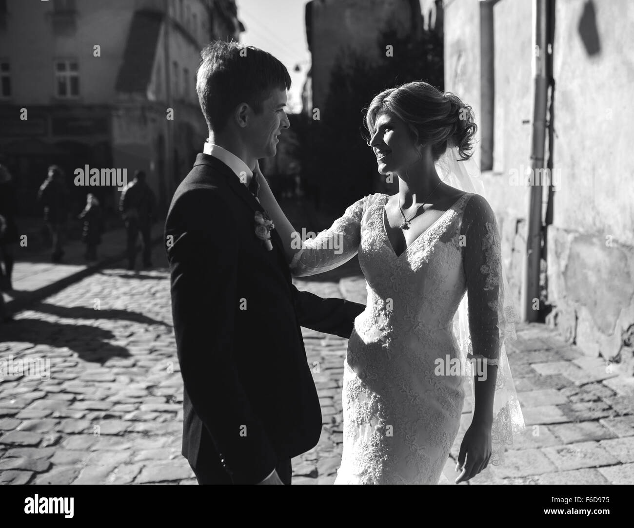 bride and groom posing on the streets Stock Photo - Alamy