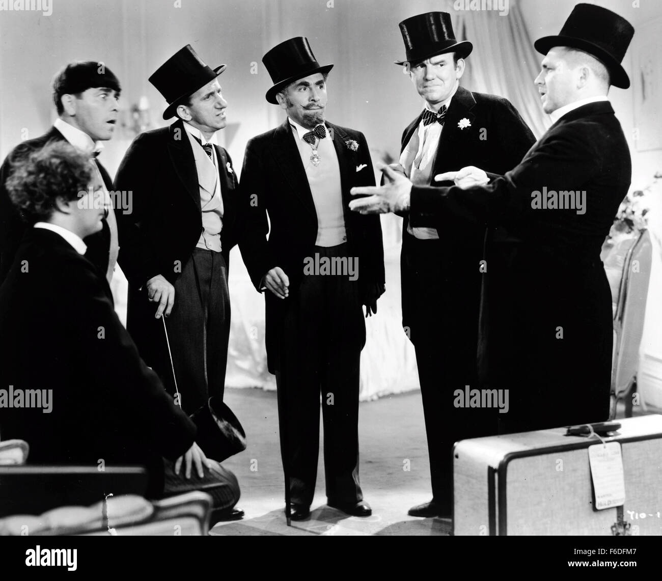 RELEASE DATE: October 20, 1933. MOVIE TITLE: Meet the Baron. STUDIO: Metro-Goldwyn-Mayer (MGM). PLOT: . PICTURED: LARRY FINE as Janitor, MOE HOWARD as Janitor, JIMMY DURANTE as Joe McGoo, JACK PEARL as Julius/Baron Munchausen, TED HEALY as Head Janitor and CURLY HOWARD as Janitor. Stock Photo