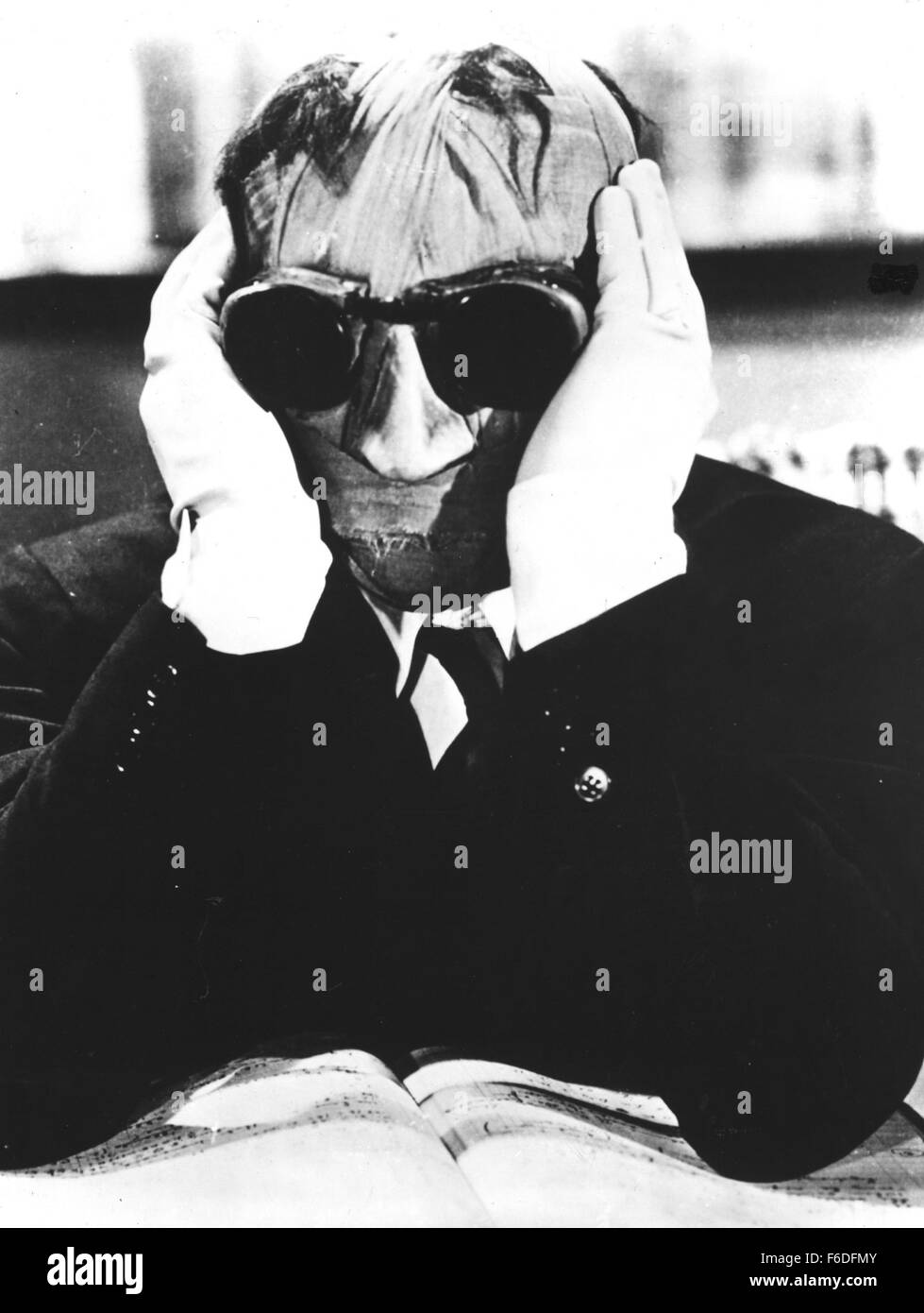 RELEASE DATE: November 13, 1933. MOVIE TITLE: The Invisible Man. STUDIO: Universal Pictures. PLOT: A mysterious man, whose head is completely covered in bandages, wants a room. The proprietors of the pub aren't used to making their house an inn during the winter months, but the man insists. They soon come to regret their decision. The man quickly runs out of money, and he has a violent temper besides. Worse still, he seems to be some kind of chemist and has filled his room with messy chemicals, test tubes, beakers and the like. When they try to throw him out, they make a ghastly discovery. Mea Stock Photo