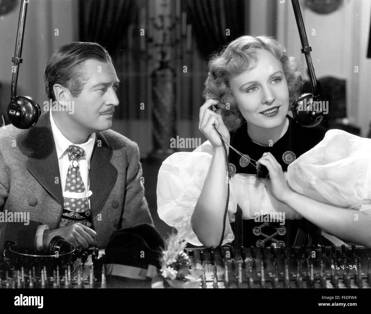 RELEASED: Feb 26, 1937 - Original Film Title: Espionage. PICTURED: EDMUND LOWE, MADGE EVANS. Stock Photo