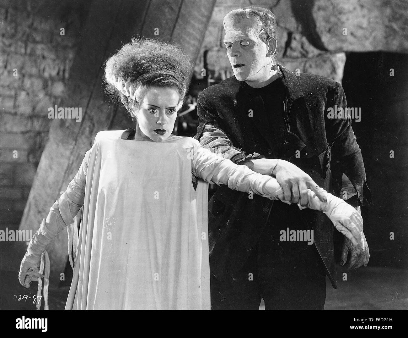 Film Title: BRIDE OF FRANKENSTEIN. DIRECTOR: James Whale. STUDIO: Universal Pictures. PLOT: Darkly witty sequel to the classic Frankenstein film about a mad scientist building a mate for his monster. Having escaped the fiery castle that engulfed him at the end of the 1931 horror classic Frankenstein, the monster (Boris Karloff) is back - now more civilized and human - even with a limited vocabulary. Baron Henry Frankenstein (Colin Clive), the monster's tormented creator, is drawn back to his experiments by effeminate, sardonic Dr. Pretorious (Ernest Thesiger). The demented Henry is convinced t Stock Photo