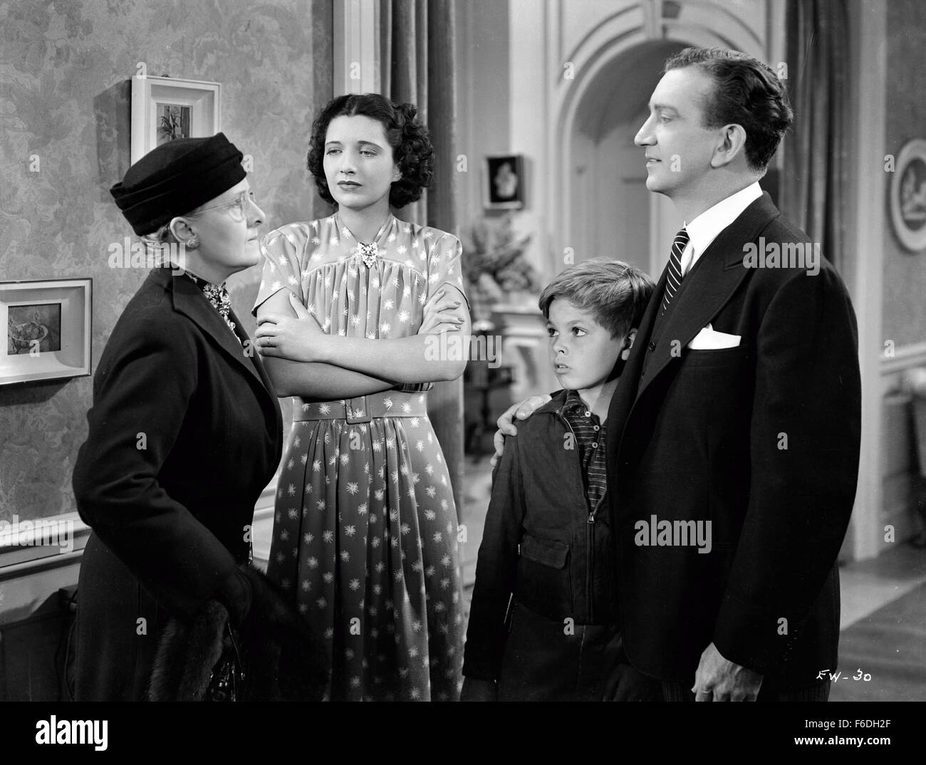 RELEASE DATE: July 9, 1938. MOVIE TITLE: My Bill. STUDIO: Warner Bros. Pictures. PLOT: Francis is the mother of four kids, three of whom are ungrateful to their widowed mom and move in with their wealthy aunt. Only Moore remains faithful to his mother. He befriends a wealthy neighbor, and when she passes away, they discover she has left her entire fortune to Moore. PICTURED: ELIZABETH RISDON as Aunt Caroline Colbrook, KAY FRANCIS as Mary Colbrook, DICKIE MOORE as Bill Colbrook and JOHN LITEL as John C. Rudlin. Stock Photo