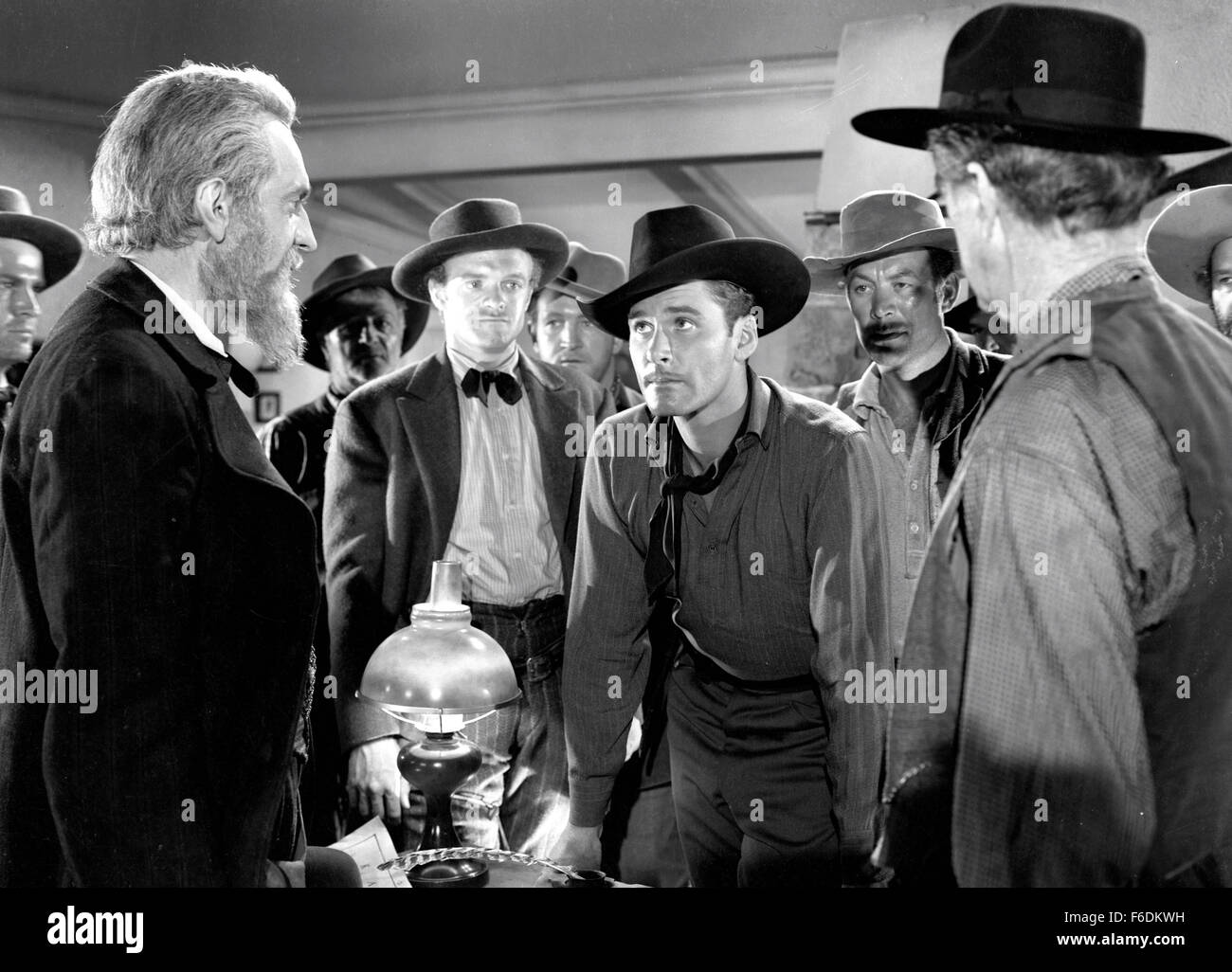 RELEASE DATE: April 8, 1939. MOVIE TITLE: Dodge City. STUDIO: Warner Bros. Pictures. PLOT: A wide-open cattle town run by Jeff Surrett. Even going on a children's Sunday outing is not a safe thing to do. What the place needs is a fearless honest Marshal. A guy like Wade Hatton, who helped bring the railroad in. It may not help that he fancies Abbie Irving, who won't have anything to do with him since he had to shoot her brother. PICTURED: ERROL FLYNN as Wade Hatton. Stock Photo