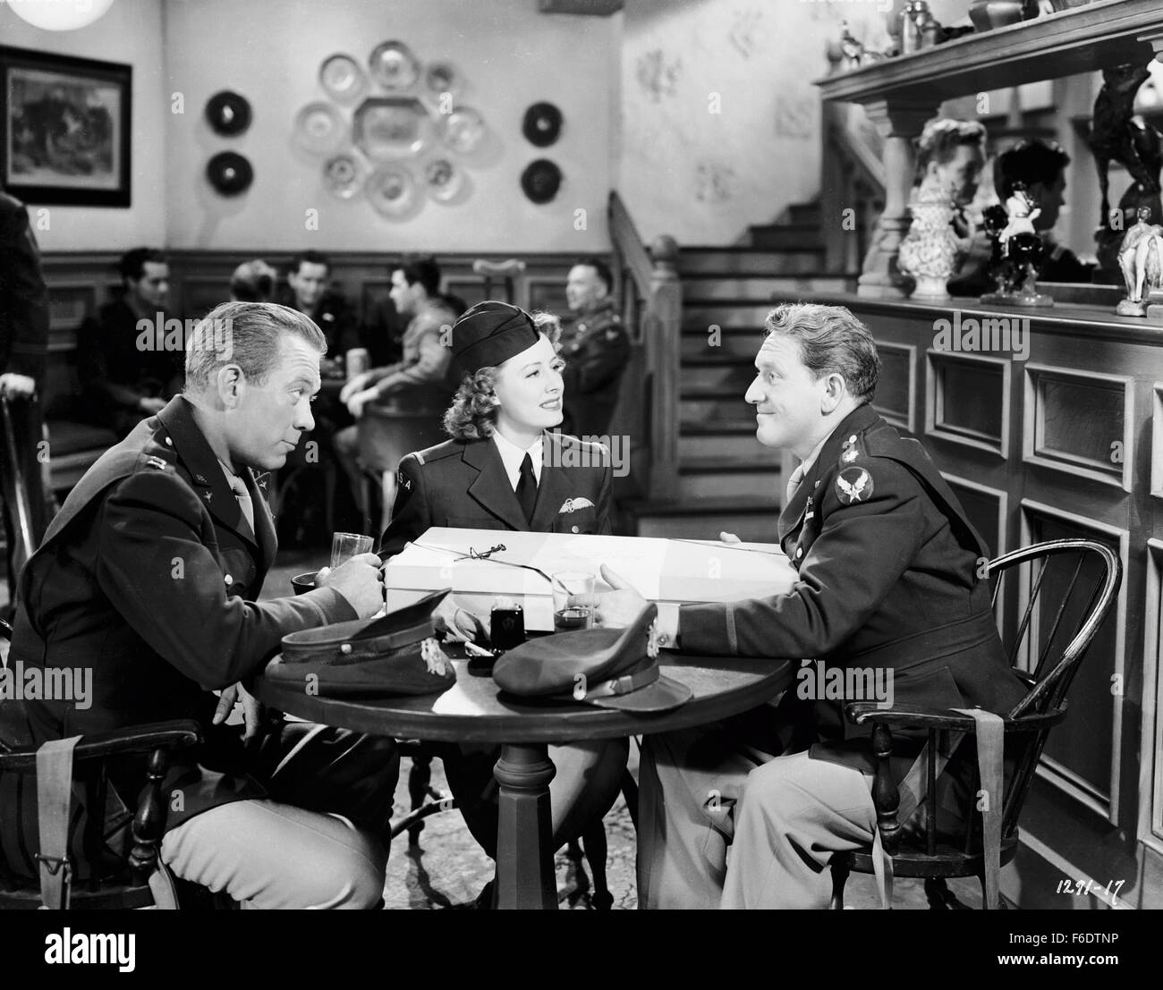 RELEASE DATE: December 24, 1943. MOVIE TITLE: A Guy Named Joe. STUDIO: Metro-Goldwyn-Mayer (MGM). PLOT: A sentimental, patriotic (if not propagandistic) Hollywood fantasy about a dead World War II bomber pilot, Maj. Pete Sandidge who becomes guardian angel to another pilot, Capt. Ted Randall, guiding Randall through battle and helping him to romance his old girlfriend, despite her excessive devotion to Sandidge's memory. PICTURED: SPENCER TRACY as Pete Sandidge and IRENE DUNNE as Dorinda Durston. Stock Photo