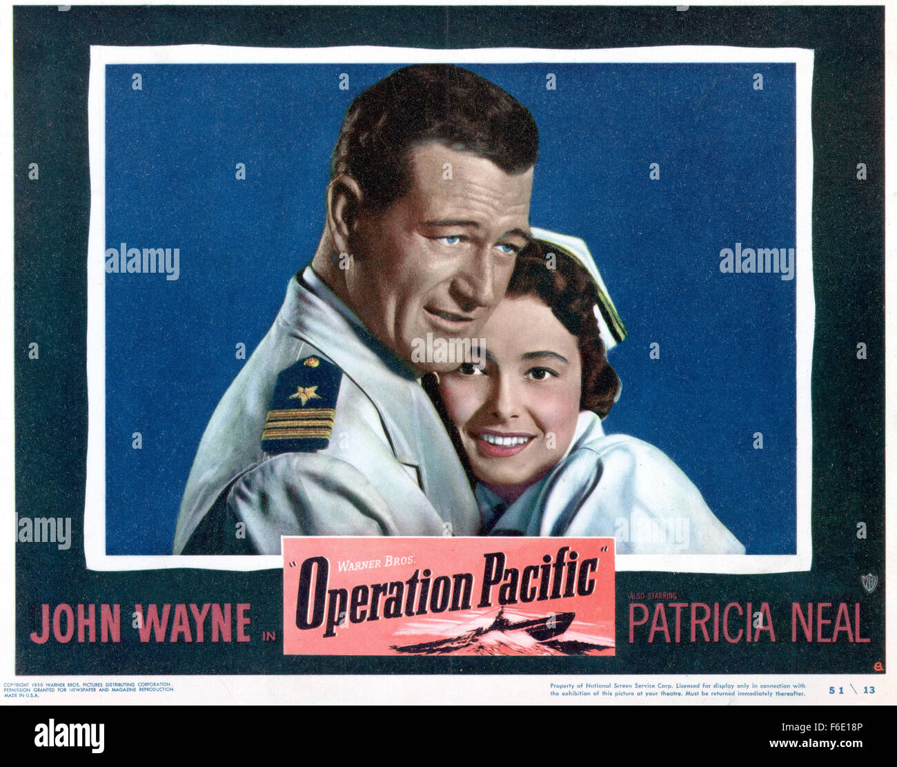 RELEASE DATE: January 27, 1951. MOVIE TITLE: Operation Pacific. STUDIO: Warner Bros. Pictures. PLOT: During WWII, Duke E. Gifford is second in command of the USS Thunderfish, a submarine which is firing off torpedoes that either explode too early or never explode at all. It's a dilemma that he'll eventually take up personally. Even more personal is his quest to win back his ex-wife, a nurse; but he'll have to win her back from a navy flier who also happens to be his commander's little brother. PICTURED: JOHN WAYNE as Lt. Cmdr. Duke E. Gifford and PATRICIA NEAL as Lt. Mary Stuart. Stock Photo