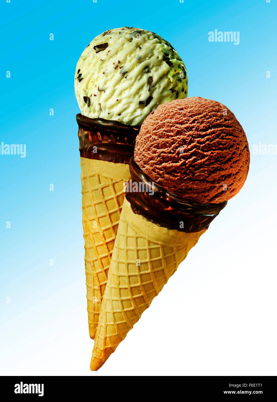 Two ice cream cones with scoops of ice cream, chocolate and pistachio Stock Photo