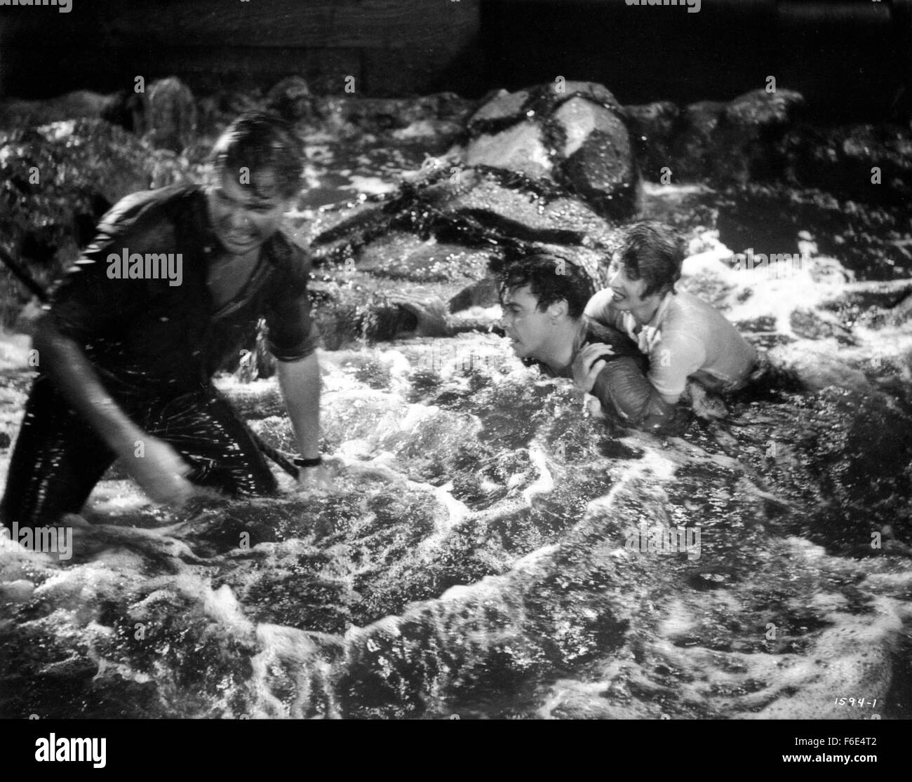 RELEASE DATE: March 30, 1953. MOVIE TITLE: Jeopardy. STUDIO: Metro-Goldwyn-Mayer (MGM). PLOT: The Stilwins are on vacation to an isolated beach in Mexico. Walking on a deserted jetty, Doug Stilwin gets his leg trapped under one of the logs. All attempts to move the log are futile and Helen Stilwin takes the car to get help. However, an escaped criminal kidnaps her. Will she be able to return to her husband before he drowns? PICTURED: BARBARA STANWYCK as Helen Stilwin, BARRY SULLIVAN as Doug Stilwin and RALPH MEEKER as Lawson, the Fugitive. Stock Photo