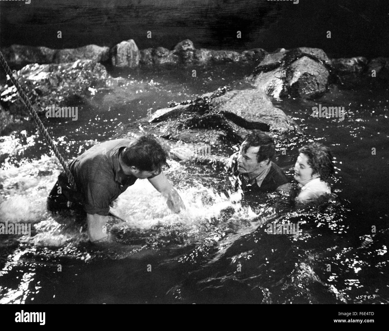 RELEASE DATE: March 30, 1953. MOVIE TITLE: Jeopardy. STUDIO: Metro-Goldwyn-Mayer (MGM). PLOT: The Stilwins are on vacation to an isolated beach in Mexico. Walking on a deserted jetty, Doug Stilwin gets his leg trapped under one of the logs. All attempts to move the log are futile and Helen Stilwin takes the car to get help. However, an escaped criminal kidnaps her. Will she be able to return to her husband before he drowns? PICTURED: BARBARA STANWYCK as Helen Stilwin, BARRY SULLIVAN as Doug Stilwin and RALPH MEEKER as Lawson, the Fugitive. Stock Photo