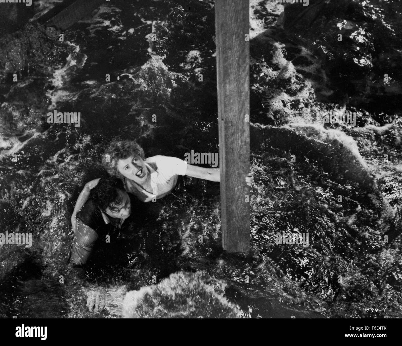 RELEASE DATE: March 30, 1953. MOVIE TITLE: Jeopardy. STUDIO: Metro-Goldwyn-Mayer (MGM). PLOT: The Stilwins are on vacation to an isolated beach in Mexico. Walking on a deserted jetty, Doug Stilwin gets his leg trapped under one of the logs. All attempts to move the log are futile and Helen Stilwin takes the car to get help. However, an escaped criminal kidnaps her. Will she be able to return to her husband before he drowns? PICTURED: BARBARA STANWYCK as Helen Stilwin and BARRY SULLIVAN as Doug Stilwin. Stock Photo