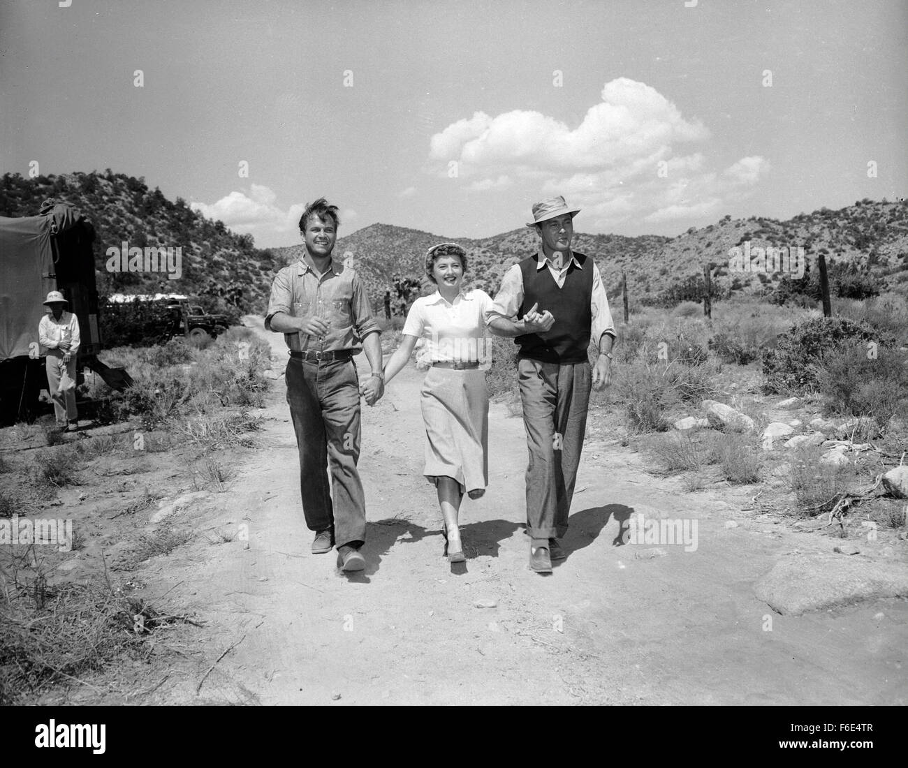 RELEASE DATE: March 30, 1953. MOVIE TITLE: Jeopardy. STUDIO: Metro-Goldwyn-Mayer (MGM). PLOT: The Stilwins are on vacation to an isolated beach in Mexico. Walking on a deserted jetty, Doug Stilwin gets his leg trapped under one of the logs. All attempts to move the log are futile and Helen Stilwin takes the car to get help. However, an escaped criminal kidnaps her. Will she be able to return to her husband before he drowns? PICTURED: BARBARA STANWYCK as Helen Stilwin, BARRY SULLIVAN as Doug Stilwin and RALPH MEEKER as Lawson, the Fugitive. Stock Photo