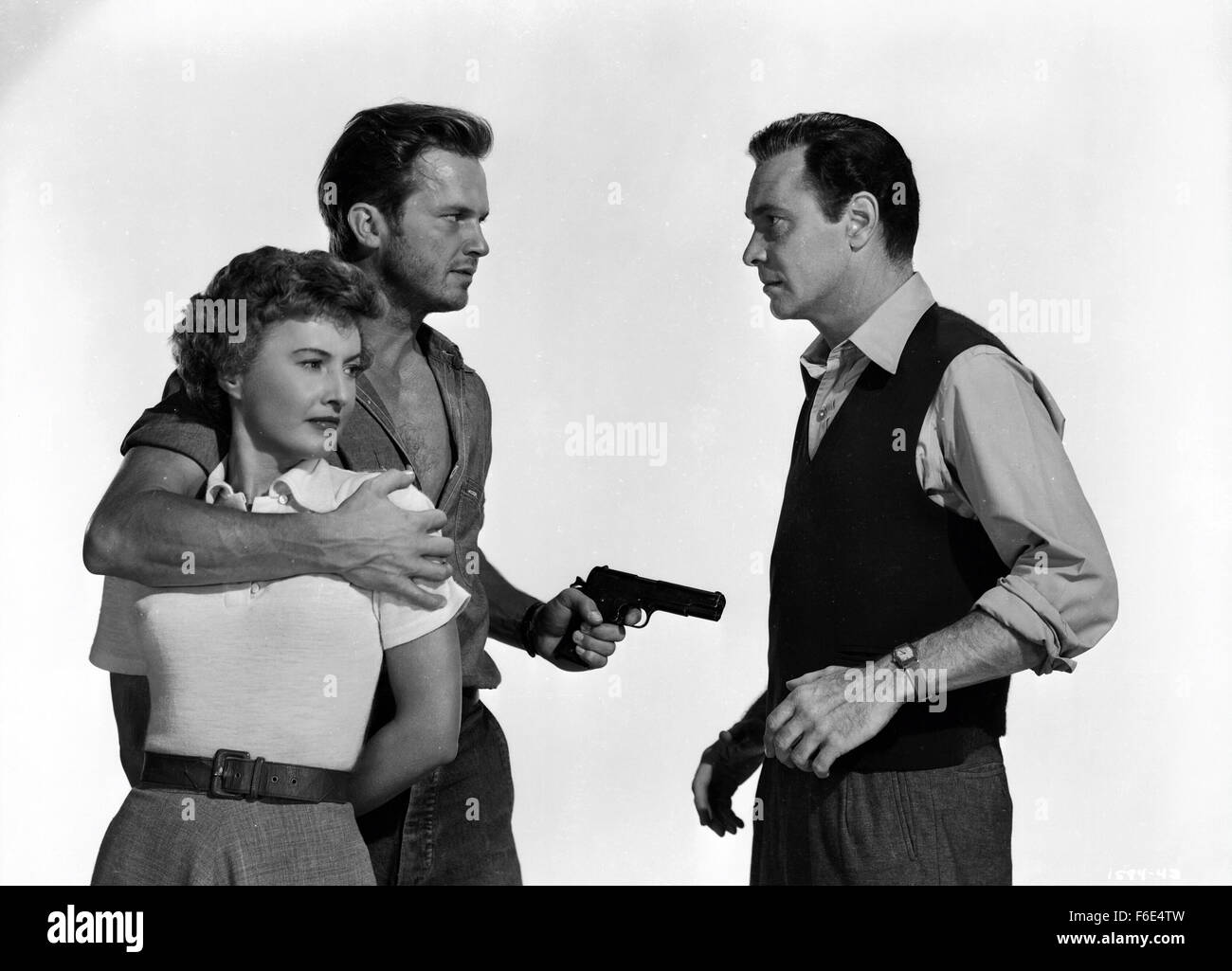 RELEASE DATE: March 30, 1953. MOVIE TITLE: Jeopardy. STUDIO: Metro-Goldwyn-Mayer (MGM). PLOT: The Stilwins are on vacation to an isolated beach in Mexico. Walking on a deserted jetty, Doug Stilwin gets his leg trapped under one of the logs. All attempts to move the log are futile and Helen Stilwin takes the car to get help. However, an escaped criminal kidnaps her. Will she be able to return to her husband before he drowns? PICTURED: BARBARA STANWYCK as Helen Stilwin, BARRY SULLIVAN as Doug Stilwin and RALPH MEEKER as Lawson, the Fugitive. Stock Photo
