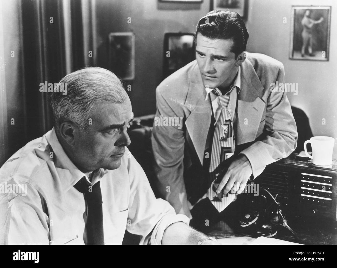 RELEASE DATE: October 11, 1953. MOVIE TITLE: Hot News. STUDIO: Monogram Pictures. PLOT: Ex-prize fighter Mark Miller, now a sports writer, sets out to expose a murderous gambling ring led by Dano Rizzo. He first learns about the ring when when a fighter dies as a result of ring injuries in a mis-matched fight. The boxer took the fight because of his love for Doris Burton, actually the girl friend of Rizzo. Doris' brother Bill gets involved when Rizzo threatens to ruin the (Credit Image: Entertainment Pictures) Stock Photo