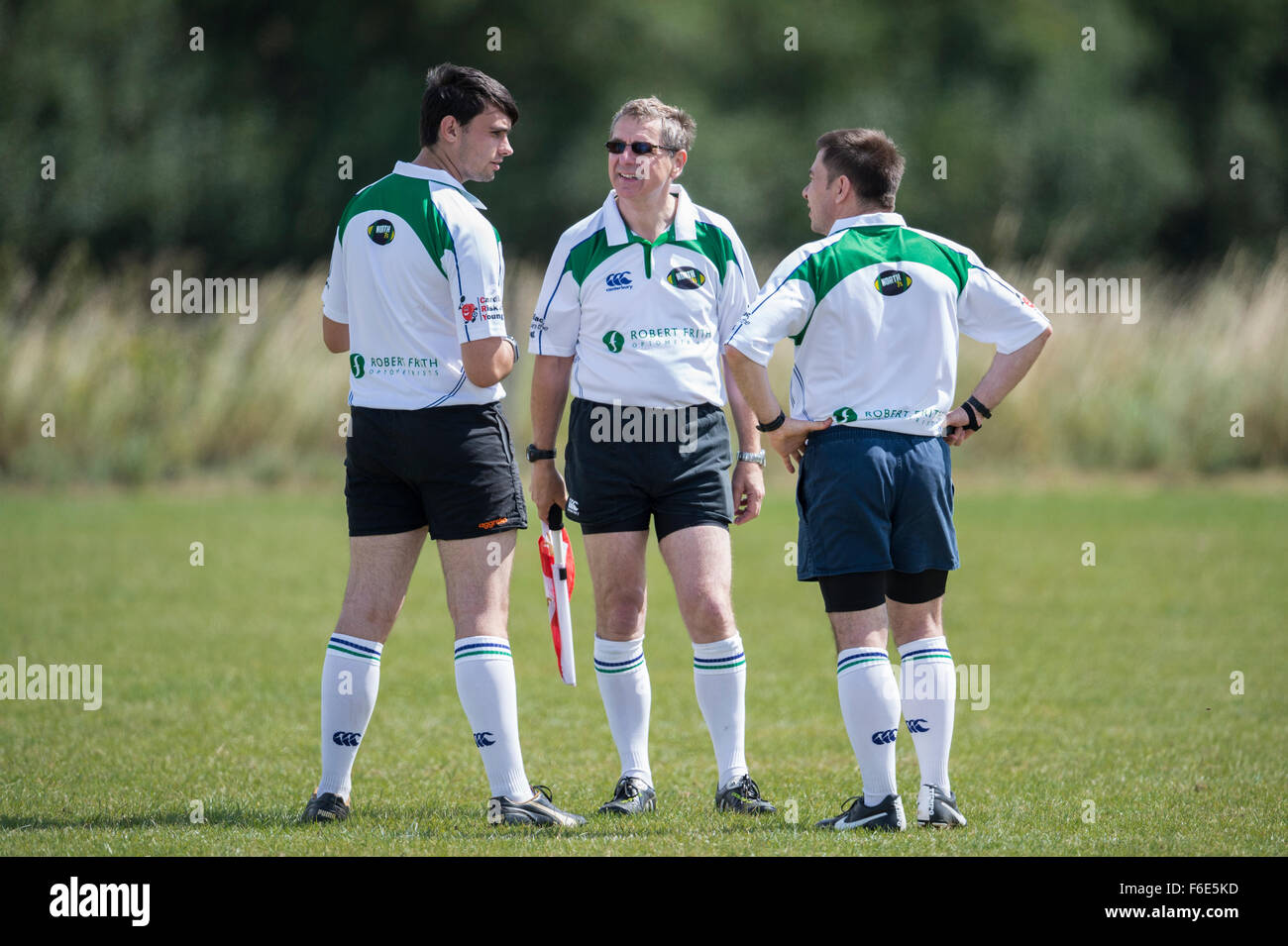 Sat, 25th July 2015 - North Dorset 7s tournament - Gillingham, Dorset, England. UK. Referee and linesmen consulting. Stock Photo