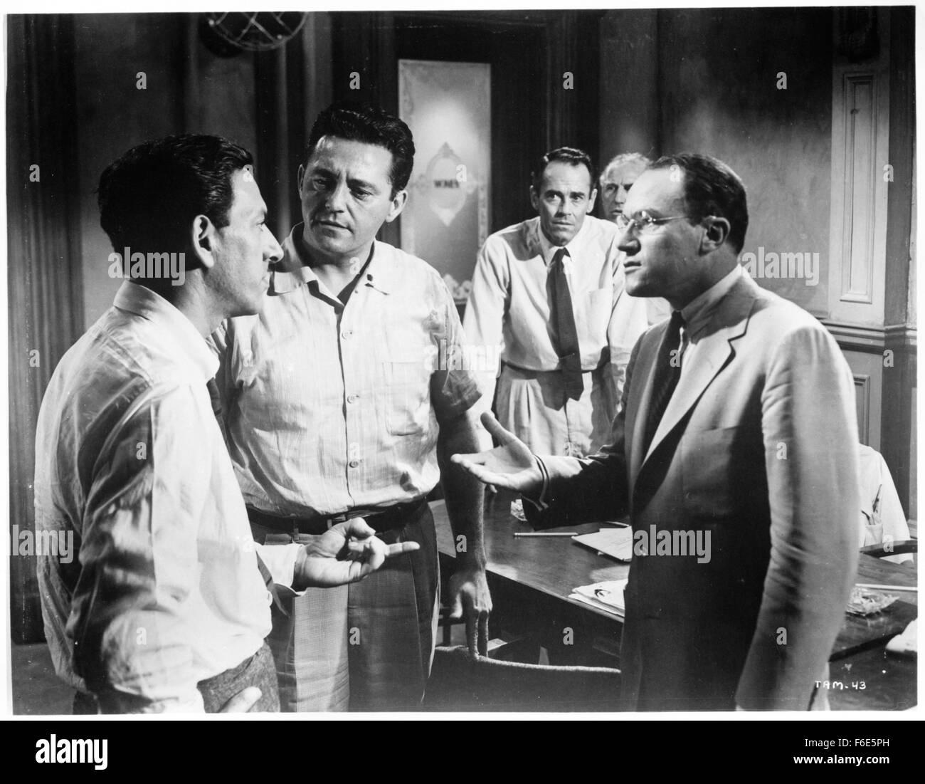 RELEASE DATE: July 29, 1957. MOVIE TITLE: 12 Angry Men. STUDIO: Orion-Nova Productions. PLOT: The defence and the prosecution have rested and the jury is filing into the jury room to decide if a young Spanish-American is guilty or innocent of murdering his father. What begins as an open and shut case of murder soon becomes a mini-drama of each of the jurors' prejudices and preconceptions about the trial, the accused, and each other. Based on the play, all of the action takes place on the stage of the jury room. PICTURED: HENRY FONDA as Juror Stock Photo